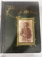Front cover showing title, decoration and portrait panel