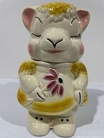 Front showing lamb face, floral detail, overall appearance