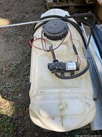 Full view of sprayer tank with pump, hose and wand