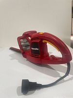 Full view of Homelite hedge trimmer showing body and power cord