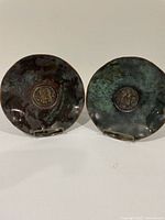 Front view of both copper plates on stands