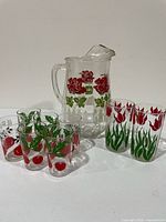 Group shot showing pitcher and all seven glasses