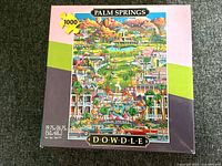 Front of Dowdle Palm Springs puzzle box showing artwork and piece count