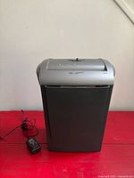 Front view of shredder with power adapter