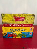 Stacked view of all four game boxes showing titles and relative size