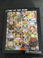 Front of puzzle box showing Day of the Dead artwork and piece count