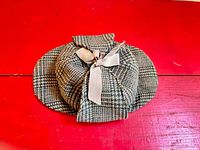 Top view of tweed deerstalker showing dual brims and bow