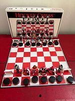 Overall view of chess set on board with box in background