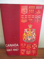 Front cover of Canada One Hundred 1867-1967 book showing dust jacket design