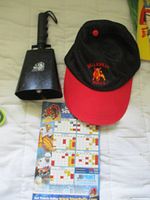 Cap, cowbell and magnetic schedule arranged on surface