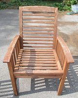 Front view of slatted acacia wood chair