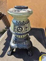 Front angled view of ceramic potbelly stove model