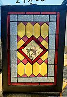 Full view of stained glass window showing design and colours