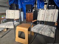 Two chrome cantilever chairs and Ikea bent plywood table shown together