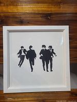 Front view of framed Beatles silhouette print