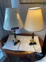 Both lamps with shades displayed on table