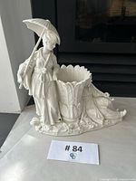 Full view of Nymphenburg porcelain figurine with attached bud vase and parasol