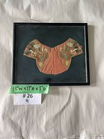 Full view of framed embroidered cuff panel with size note