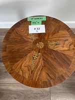 Top view showing sunburst veneer and brass inlay, dimensions noted