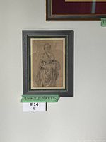 Frontal view of framed drawing showing full artwork and dimensions tag