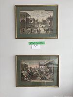 Front view of both framed prints on wall
