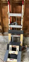 Full view of hand truck behind stacked mover dollies