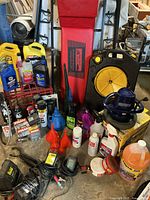 Overall lot with creeper, reel, buffer, fluids and tools