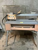 Front view of tile cutter on stand