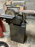 Left front view showing disc, belt arm and stand