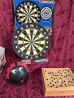Full lot: dartboard, marble labyrinth, ladybug bowling ball
