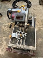 Top view showing saw, sliding table, miter guide and blade guard