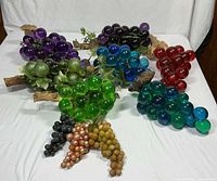 All ten grape clusters arranged on white backdrop