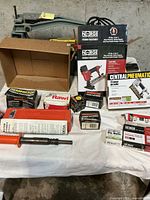 Overall lot with Remington tool, Norge nailer box, Central Pneumatic pin nailer box, fastener boxes