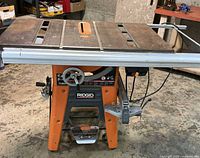 Full view of Ridgid TS3650 table saw on stand with rip fence installed