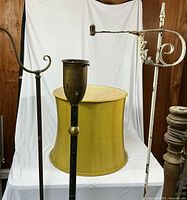 Three lamp bodies and lampshade grouped