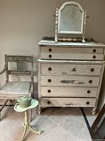 Full view of dresser, mirror, chair, table and teapot