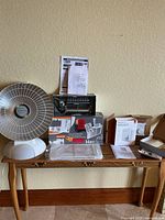 Entire lot on console table showing all boxed and unboxed components