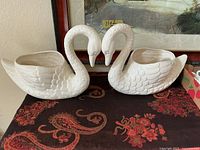 Both ceramic swan planters side by side on table