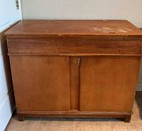 Front view of wood buffet cabinet closed