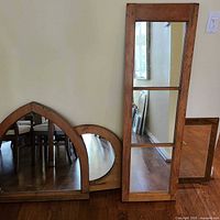 Three of the pine mirrors: narrow four-pane rectangular, pointed arch, circular