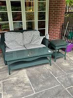 Loveseat, coffee table, side table arrangement