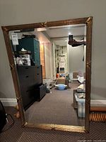 full view of mirror showing frame and reflection