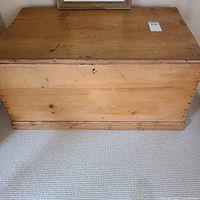 Front view of closed pine blanket box