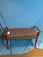 Full view of upholstered bench showing fabric, frame, and dimensions perspective