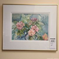Framed watercolor painting of roses in gold-tone frame