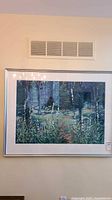 Full view of framed watercolor painting on wall