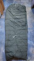 Outer sleeping bag laid flat stitched straps visible