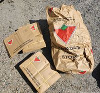 Bundles of folded Canadian Tire yard waste bags and one loose bag