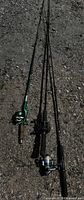 Three fishing rods laid out showing overall length and attached reels