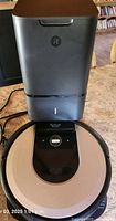 Roomba i6 seated on Clean Base tower